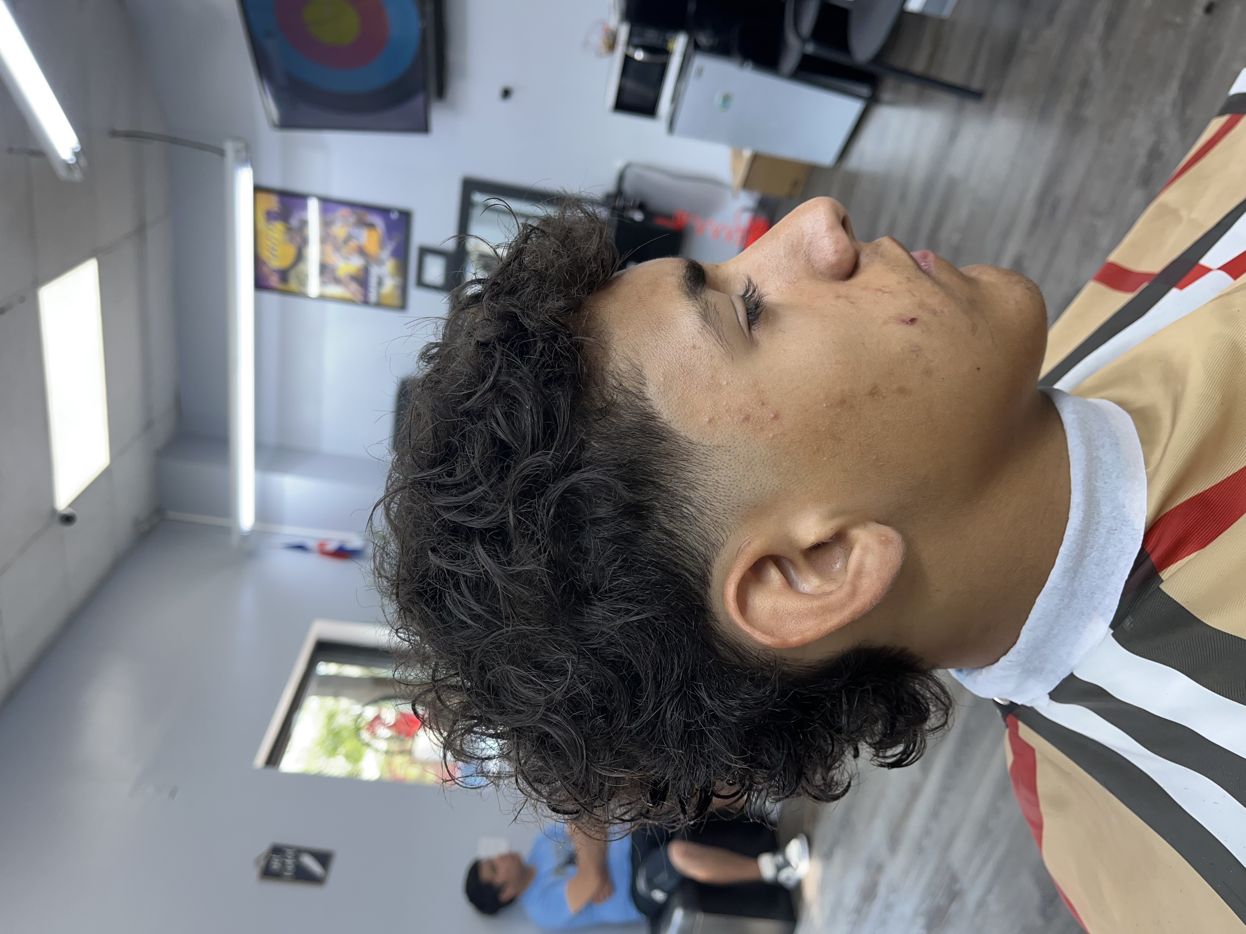 Textured curly cut with taper work from Jessi G Style